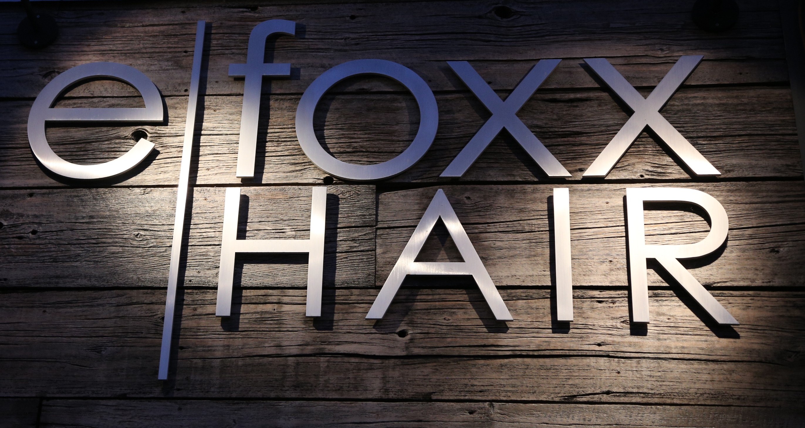 Efoxx HAIR luxury salon storefront in Los Angeles, featuring elegant signage and modern architecture